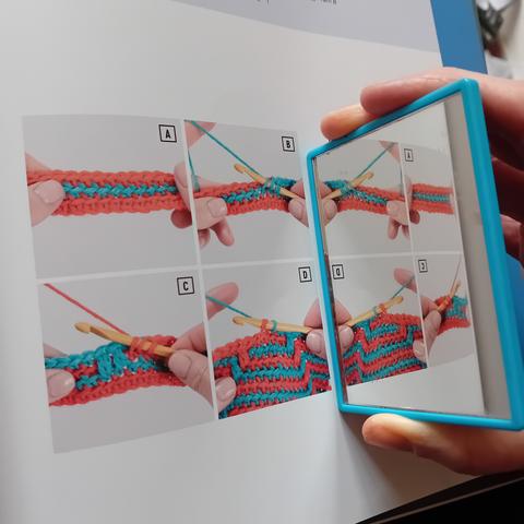 Page of photos demonstrating how to do crochet, right handed, with a hand mirror reflecting the pictures, so that they make sense to someone who is left handed.