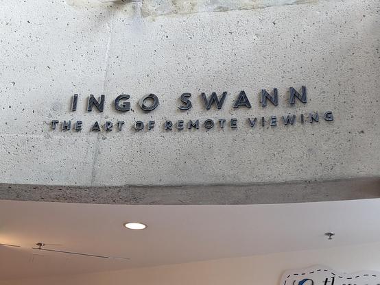 A sign at AVAM consisting of metal letters mounted on stone, reading: 

INGO SWANN
The art of remote viewing
