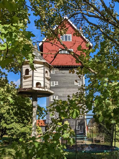 House in the Clouds in Thorpness with a traditional dovecot in the foreground.