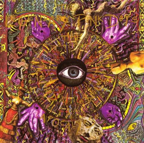 Album cover: The Crushed Velvet Apocalypse by The Legendary Pinks Dots. A wild and chaotic psychedelic painting in golds, purples and reds. A single eye peers out from the centre of a multi-coloured disc. Around it are four purple hands and an assortment of masks, statues and painted figures and dragons many of which have a somewhat religious vibe, though it's hard to pin point any specific religion. Barely legible, the band name is written across the top in gold lettering that almost blends into the psychedelic painting, and -- if you focus -- you can just about make out the album title written on the outside of an inverted triangle within the central disc.