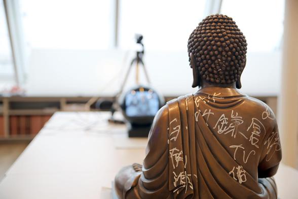 color photo of one of Nam June Paik's TV Buddha's