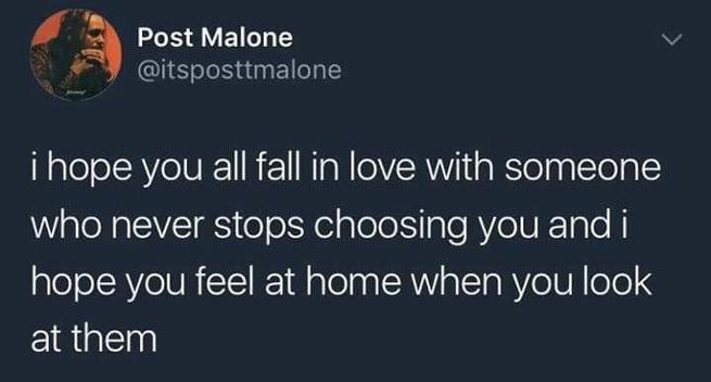 A Twitter post by Post Malone, identified by the username "@itsposttmalone." The background is dark, and the profile picture is not described. The tweet reads: "i hope you all fall in love with someone who never stops choosing you and i hope you feel at home when you look at them."
