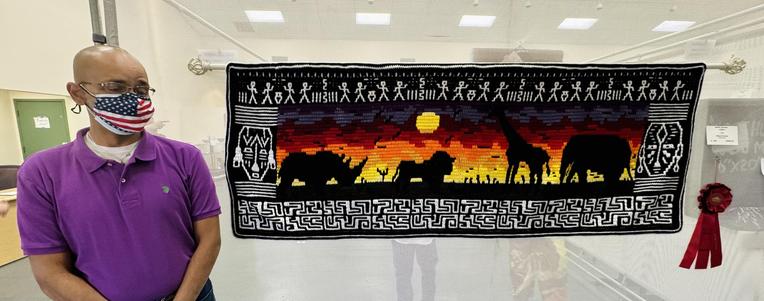 Huge Safari Sunset table runner or wall mural! Overlay Mosaic Crochet with tapestry color changes! Took 2nd place in African American Art and overall #1 Popular Choice for the 2024 New Mexico State Fair! Comes with duplicate winning ribbons for display.