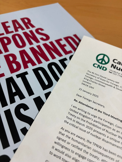A letter written by CND and addressed to the Foreign Secretary rests beside a copy of a report on the TPNW