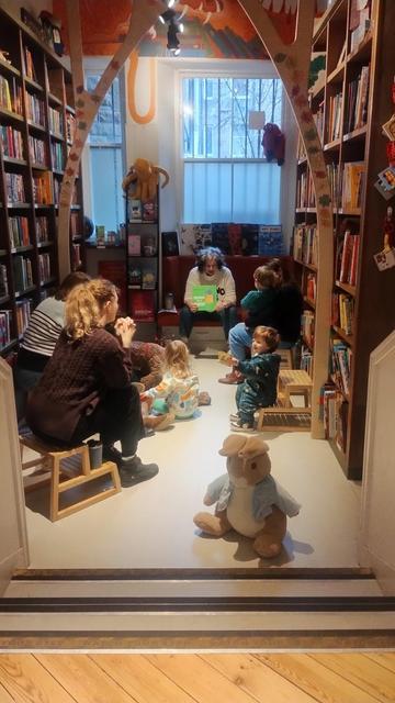 a large, cuddly Peter Rabbit guards the entrance to the children's room during the Under Fives Storytime in the Edinburgh Bookshop