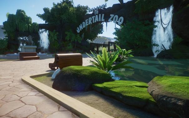 entrance to a zoo with waterfalls on either side and a large rocky overhang above the entrance that says "Welcome to Undertail Zoo"