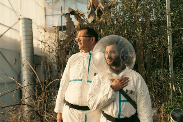 Rob Hopkins and Mr Kit stand in home made space suits for their Field Recordings from the future project.