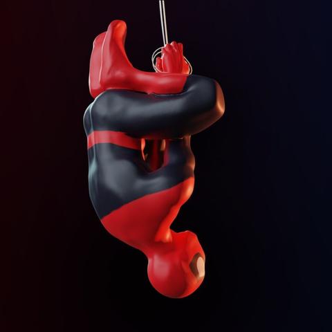 Another angle of a 3D sculpt of Spider-Man hanging upside-down from a web string.