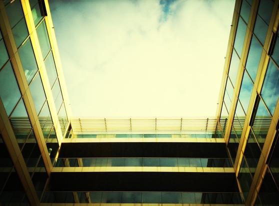 Yellow sky frames on three sides by a metal & glas structure