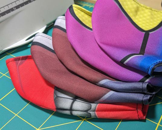 a short stack of facemasks with Momotaros, Gavv, and Valen designs