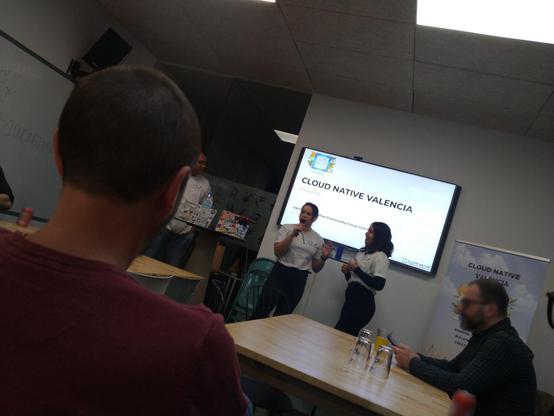 Jade Lassery speaking and Luma Levenhagen at the opening of the CLOUDNATIVEVALENCIA CNCF event at FLYWIRE