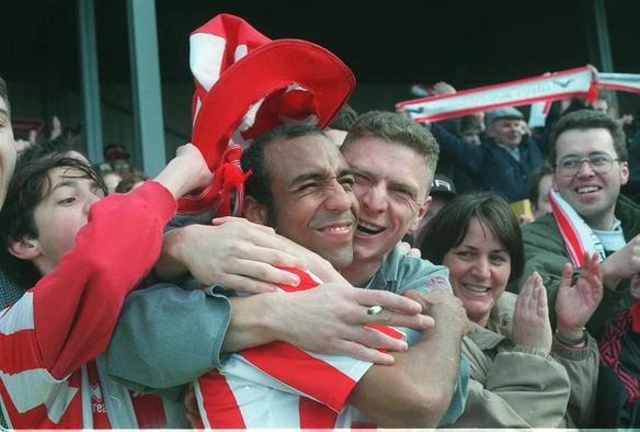 Jamie Victory being mobbed by Cheltenham fans in a photo from 1998 away at Dover.