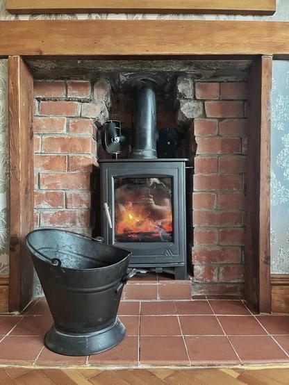 Coal fire and coal scuttle, coal burning well. Taken cause it makes me feel relaxed.