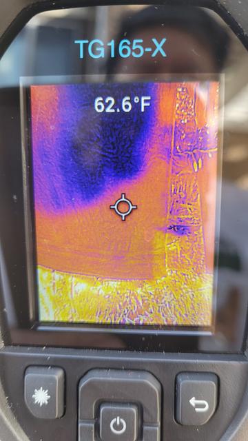 FLIR showing 62.6F in dry corner, almost the same as air temp. Dark purple above is the area folded over, still not dry.