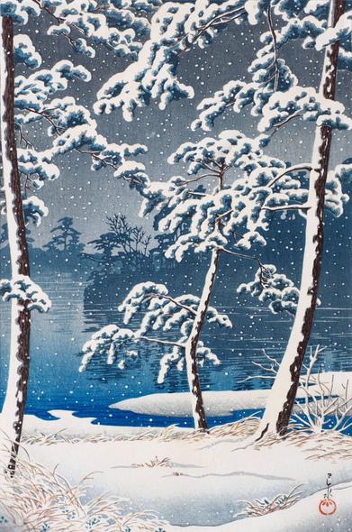 A view looking out over Tokyo's Senzoku Pond on a snowy winter's day. In the foreground, wiry pine trees stand on the edge of the pond, fresh snow clogging their branches and sticking to their trunks. Beyond, the calm surface of the pond stretches out toward dim silhouettes of more trees on the opposite side of the water. Above, the sky is dark and overcast, and snow continues to fall across the scene