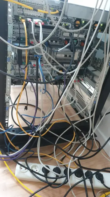 The back of the rack, with the back of the servers, with networking, KVM and power cables all over the place.