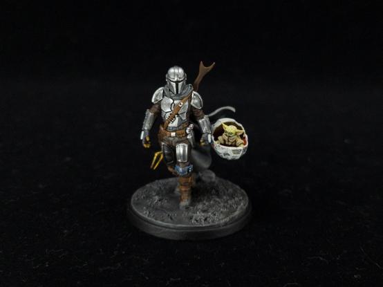 Mandalorian Star Wars character with blank armor and carrying a tiny baby Yoda Grogu in a levitating basket. I couldn't see if this was non-metallic metal or true metallic metal which should be counted as a win for mythical mothman