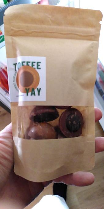 A bag of chocolate&amp;caramel treats with a roasted hazelnut inside, tastes like forbidden love