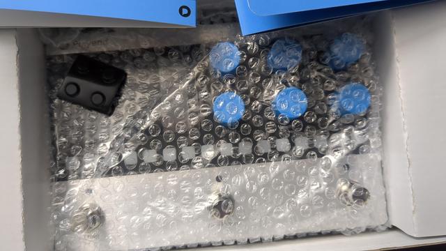 A picture of the new Polyend Step, still inside its box and wrapped in transparent plastic with bubbles.