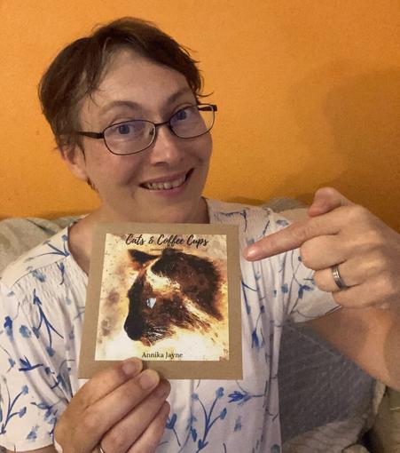 Me holding the Cats &amp; Coffee Cups CD