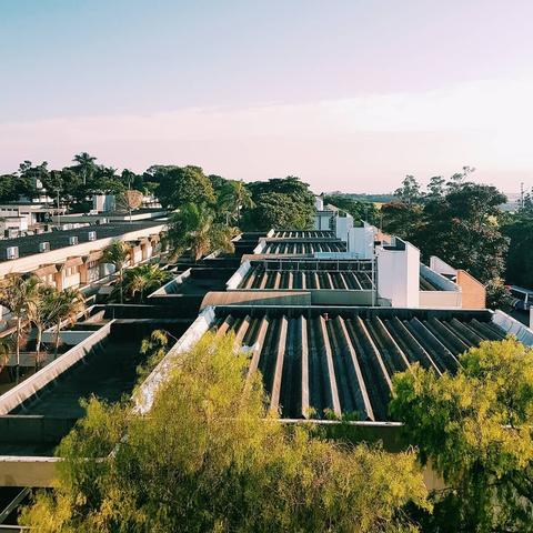 A high-angle view of several building rooftops.