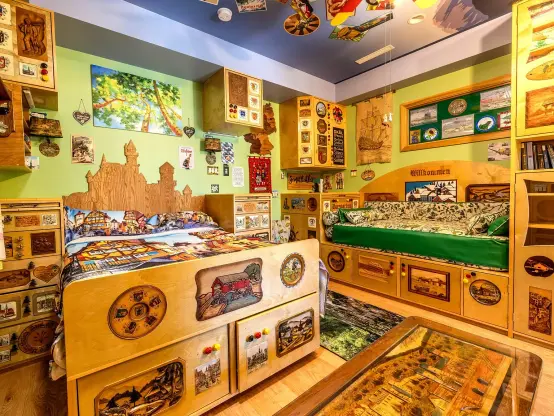 Who wouldn't want to sleep in a German-themed bedroom? Dream of dancing lederhosen-clad men beneath a duvet that appears to have a photo of a medieval street in Rothenburg ob der Tauber on it, with a headboard shaped like a castle behind you. Cosy. Also do these people have an RV lifestyle fetish of some kind? In this and basically every other room and hallway in this house, there are built in cupboards and cabinets everywhere: underneath beds and seating and lining walls. I appreciate smart storage but how many things can one family own?
