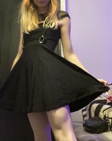 Samantha in a pretty Black Dress with bare shaven legs.