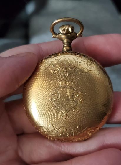 Case of a gold-plated pocket watch - identical on both sides.
