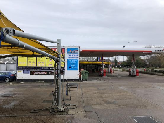Picture shows a colour photo of a humble roadside hand carwash and petrol station. It’s not the most beautiful picture you’ll see here on here TBF.
