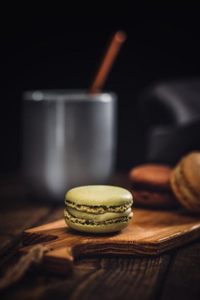 a macaron with a cup of coffee