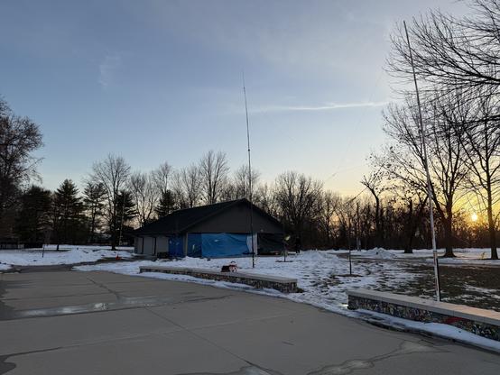 A view of the shelter and antennas during sunset.