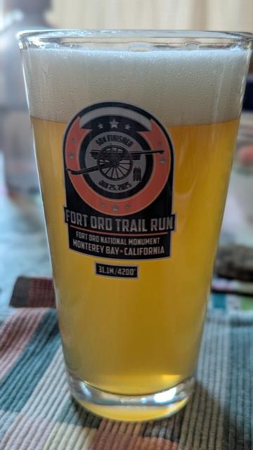 Fort Ord 50k pint glass filled with beer.