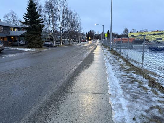 An overcast day with wet roads.  January in Alaska.  zero snow or ice on the ground