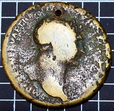 IMP CAES NERVAE TRAIANO AVG GER DAC P M TR P [COS V P P], laureate bust of Trajan to right, aegis on far shoulder My coin is holed at top and only the first part of the inscription is really readable.