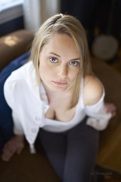 A girl looks up at the camera with a contemplative expression, maybe thinking about her big love.