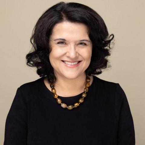 portrait photo of smiling woman with dark hair