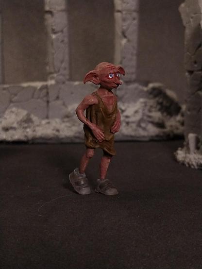 Painted miniature of Dobby the house elf.