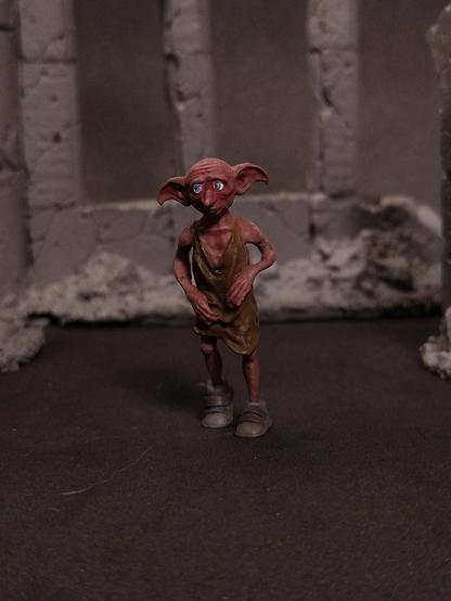 Painted miniature of Dobby the house elf.