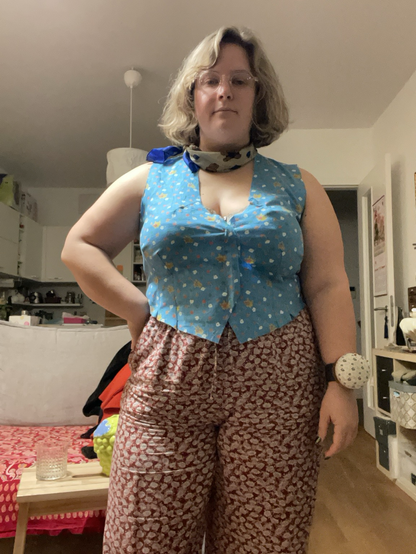 Me standing in the middle of a room, wearing a blue waistcoat muslin of the last pattern I made. I look unamused heh