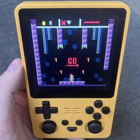 Dungeon! A video game running on a yellow handheld device.