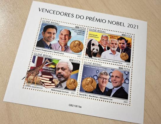 A set of four stamps from Guiné-Bissau depicting the 2021 nobel prize winners