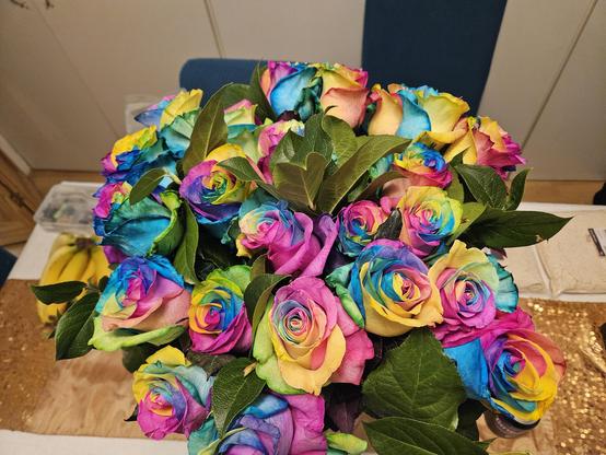 The bouquet of roses I got for my birthday. Each rose has been dyed bright rainbow colours, they are gorgeous and a happy riot of colours