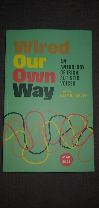 Book cover of Wired Our Own Way: An Anthology of Irish Autistic Voices edited my Niamh Garvey. Book is green with different coloured squiggles.