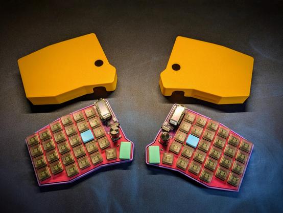 3d printed enclosure next to a sofle choc