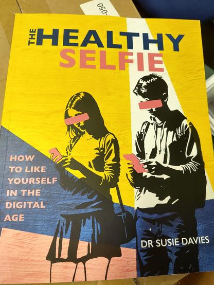 A copy of Dr Susie Davies' book "The Healthy Selfie" How to Like Yourself in the digital age.