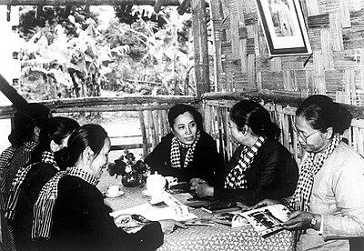 Black and white photo of Nguyễn Thị Bình (centre-left) with Nguyễn Thị Định alongside other "Long-Haired Army" leaders (Viet Cong women).