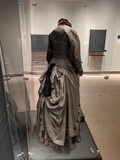 The same dress from the side back, showing the draping of the skirt. The bustle underneath is not big enough.