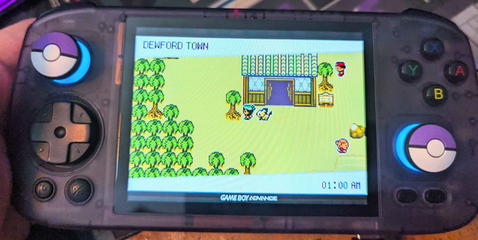 It's Pokémon Emerald but with generation 2 (Gold and Silver) graphics. The player's character standing outside the Gym in Dewford Town.