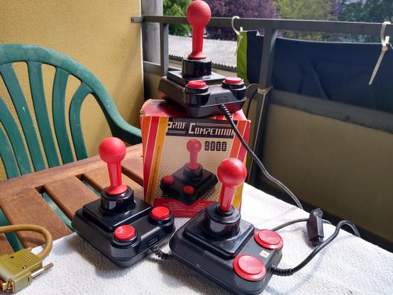 Three Competition Pro Joysticks and one box of it.