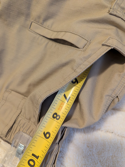 My new CQR pants. I have a tape measure in the pocket, showing it going a little less than 9 inches.
